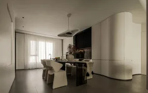 A modern, all-white kitchen featuring sleek lines and contemporary design elements.