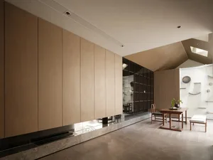Modern showroom displaying various materials and furniture pieces.