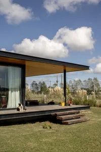 A modern home with a transparent roof made of wood