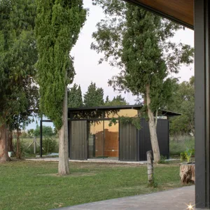 Modern house exterior with metal siding and large glass windows