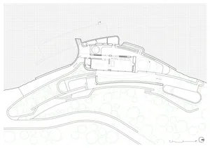 A detailed architectural floor plan featuring a landscape design with stone, glass, and metal elements.