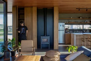 A modern living room with wooden walls and furniture