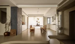 A modern residential dining space with neutral-toned materials.