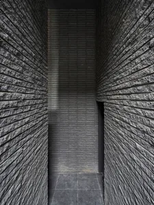 A modern interior space featuring a brick wall.