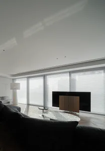 Contemporary living space featuring metallic sofa and coffee table.
