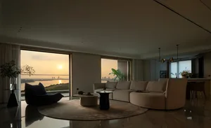 Minimalist living room featuring marble furniture and floor-to-ceiling windows with a scenic view.