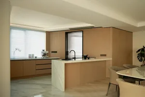 Contemporary residential kitchen featuring marble countertops and concrete flooring.