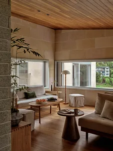 Industrial-style living room featuring timber furnishings and a minimalist design.