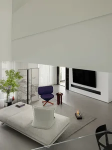 Contemporary living room with minimalist furniture, neutral color palette, and modern design elements.