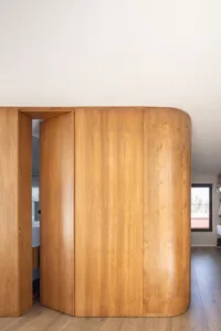 Modern interior space featuring wooden walls and minimalist design