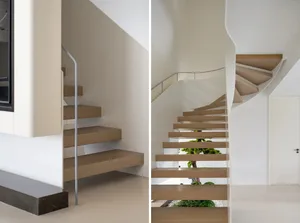 Modern, minimalist indoor space featuring wooden stairs with sleek, elegant lines.