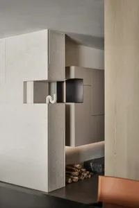 Modern kitchen with granite countertops and minimalist design.