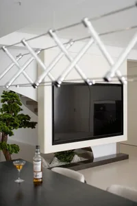 Modern living room featuring a concrete fireplace and minimalist design.