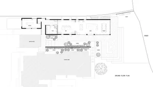 A detailed architectural floor plan depicting a modern living space with concrete tiles, featuring functional zones like kitc