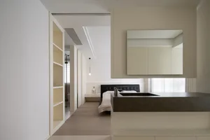 Modern minimalist bedroom featuring concrete and marble materials.