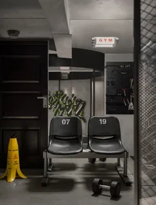 Gym locker room with metal seats and graffiti artwork