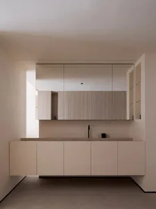 Modern minimalist bathroom featuring wood accents and a sleek, minimalist design.