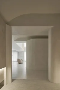 A minimalist interior designed with neutral tones and clean lines.