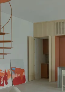 A modern apartment interior with a wooden kitchen, minimalist design, and contemporary elements.