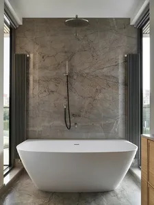 A modern bathroom featuring a freestanding bathtub with a marble wall and floor.