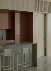 Modern residential kitchen featuring metal and wooden materials