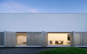 A minimalist residential interior featuring modern materials and design.