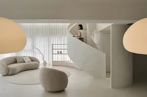A modern living room with neutral-toned furniture and minimalist decor.