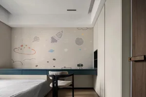 Minimalist bedroom with a bi-color palette featuring a bed, chair, and desk.