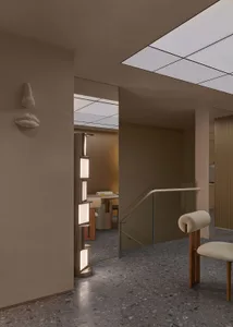 Minimalist interior design with concrete materials and sleek lines.