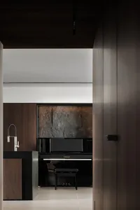 A modern interior space featuring minimalist design with wood and metal materials.