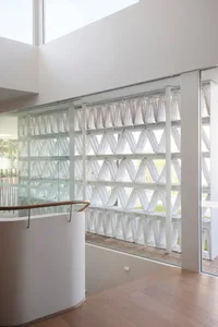 A minimalist commercial interior with clear glass blocks in the window.