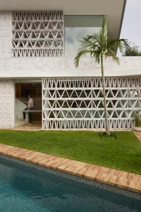 Modern residential exterior with brick and glass materials.