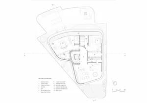 Second-floor layout of a modern residential building with designated areas for dining, living, and private bedrooms with bath