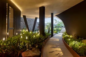 A modern entrance featuring concrete and steel materials.