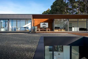 Modern residential building featuring metal and glass materials