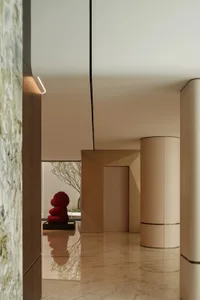 Modern minimalist interior design with marble finishes and clean lines.