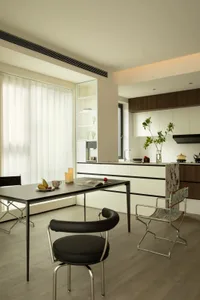 A modern residential kitchen featuring white kitchen cabinets and a clean, minimalist design.
