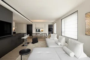 A minimalist living room with neutral color schemes and furniture.