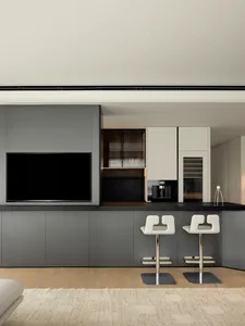 Modern residential kitchen with a bar counter, white chairs, and minimalist design.