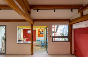 A contemporary residential space featuring a mix of metal and wooden elements.