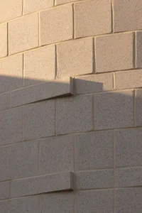 A close-up view of modern architectural concrete details showcasing clean lines and textured surface.