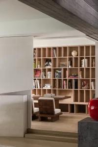 Modern library with wooden bookshelf and chairs