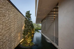 A minimalist exterior space with concrete and metal elements.