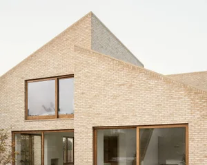 Modern residential house with brick exterior and large windows