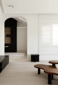 A modern living room with wooden furniture and minimalist design.