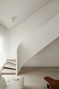 A minimalist staircase made of wood with clean lines and a smooth finish.