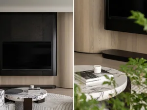 A modern living room with marble furniture and minimalist design elements.