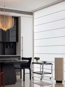 Modern living room featuring metal, fabric, wood, and glass furniture.