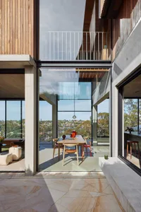 Modern residential space featuring concrete and glass materials.