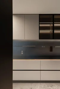 Modern, minimalist kitchen featuring metallic cabinets and sleek design elements.